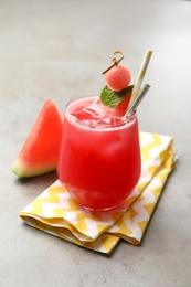 Photo of Delicious fresh watermelon drink on grey table