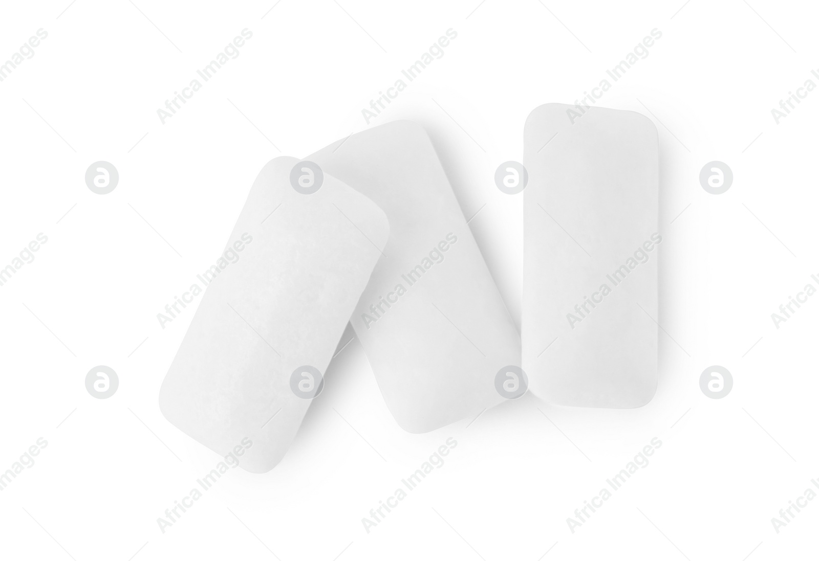 Photo of Tasty chewing gums on white background, top view