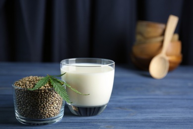 Photo of Composition with hemp milk and seeds on table