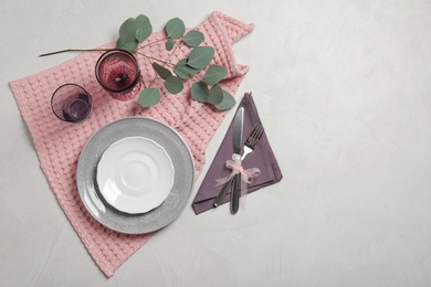 Photo of Stylish elegant table setting on light background, top view. Space for text