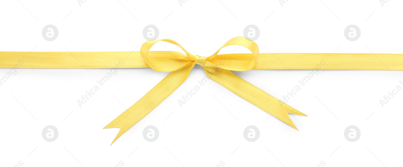 Photo of Yellow satin ribbon with bow on white background, top view