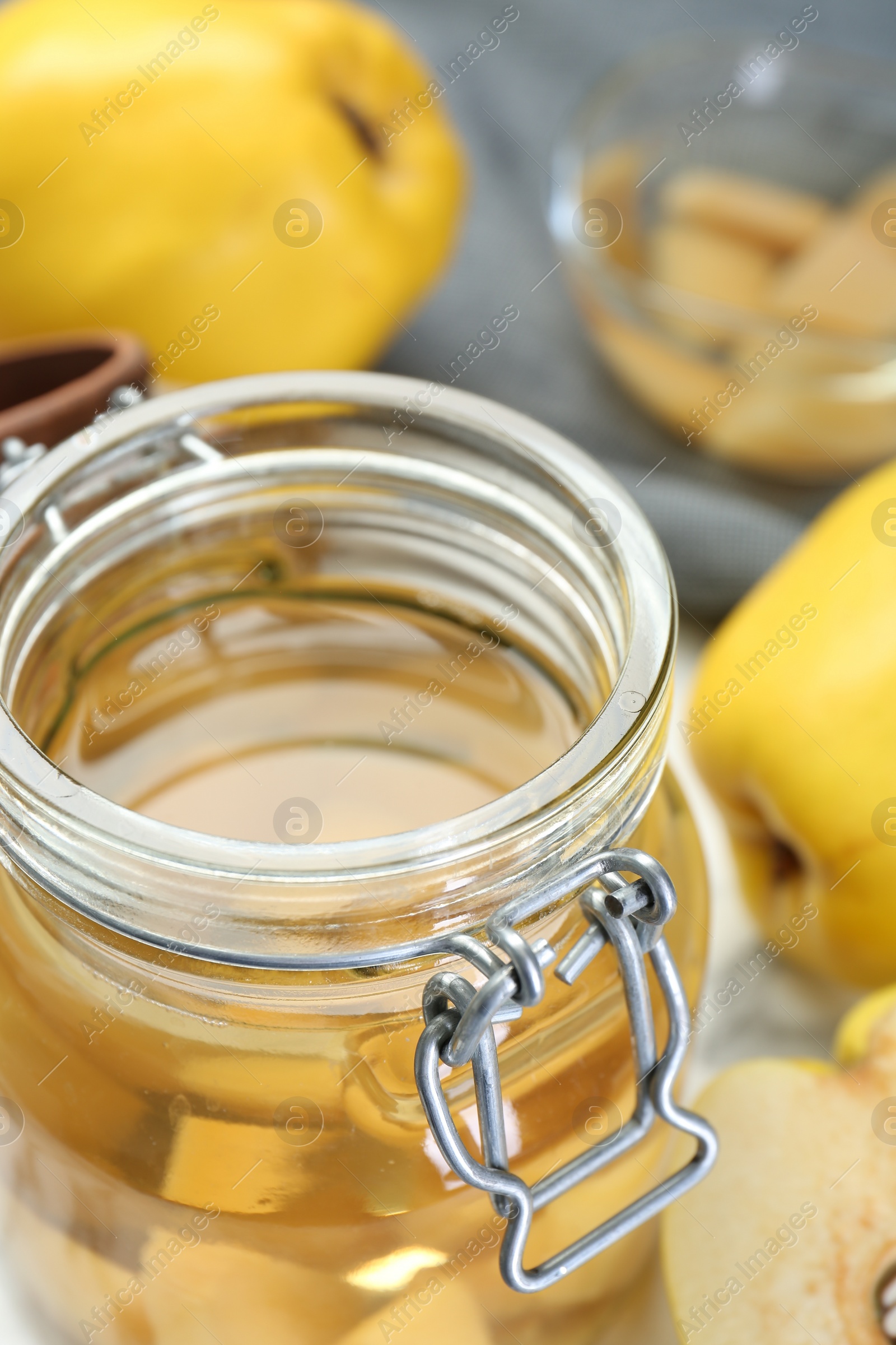 Photo of Delicious quince drink in jar, closeup view