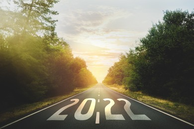 Image of Start new year with fresh vision and ideas. 2022 numbers on asphalt road