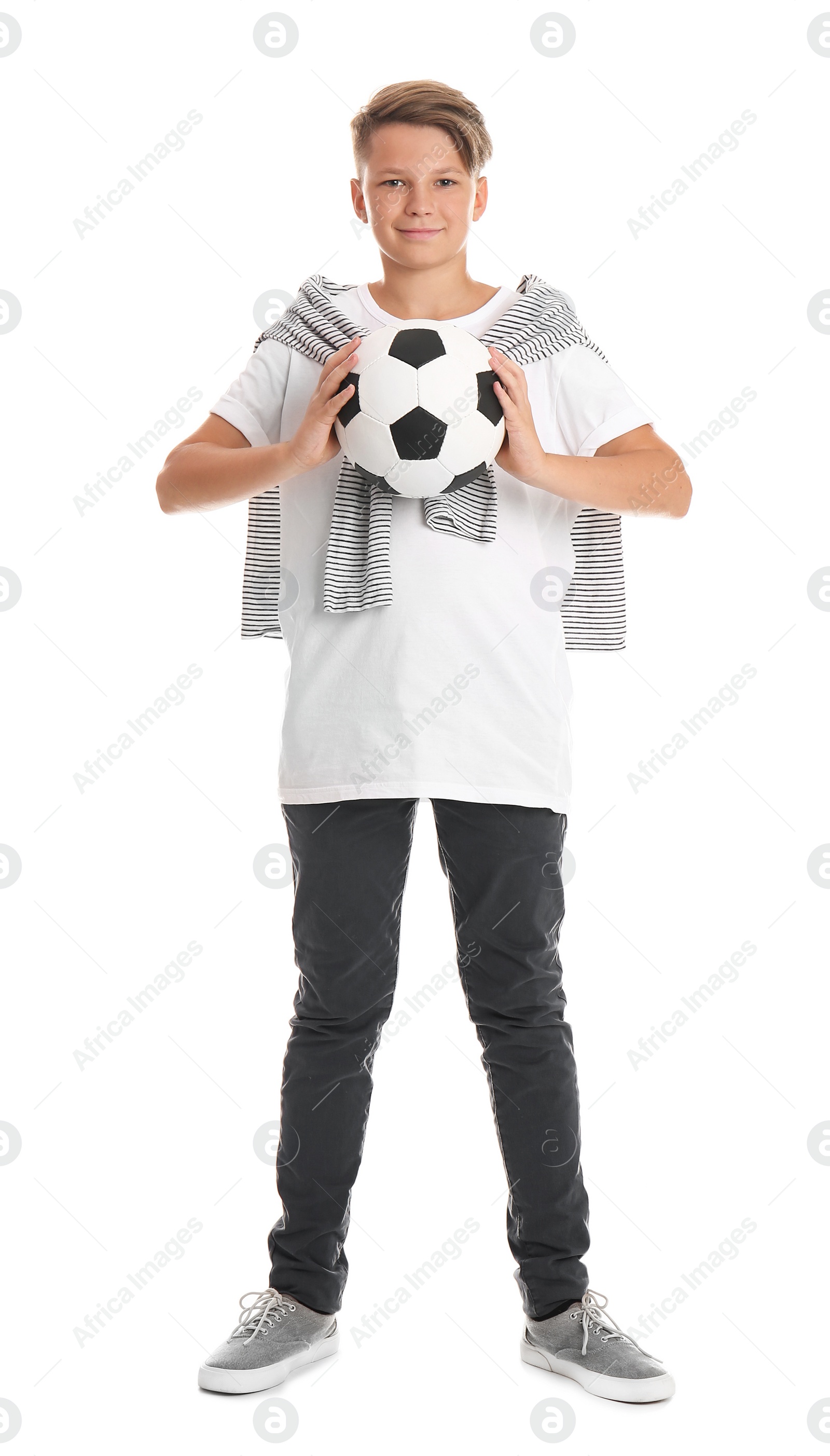 Photo of Teenage boy with soccer ball on white background