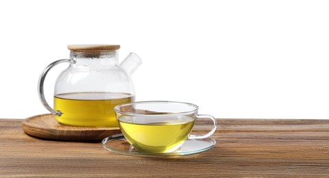 Refreshing green tea in cup and teapot on wooden table against white background