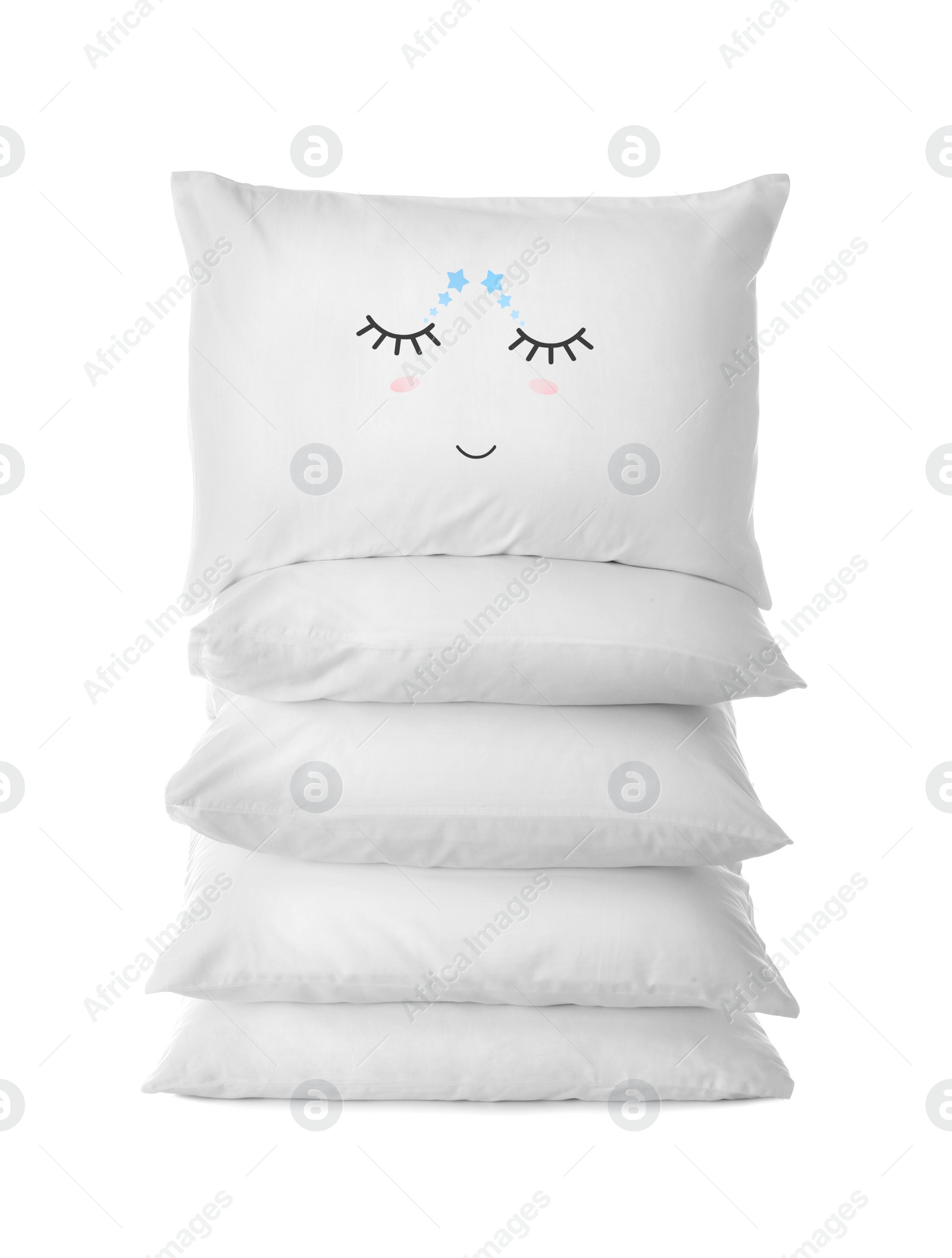 Image of Stack of soft pillows, one with cute face on white background