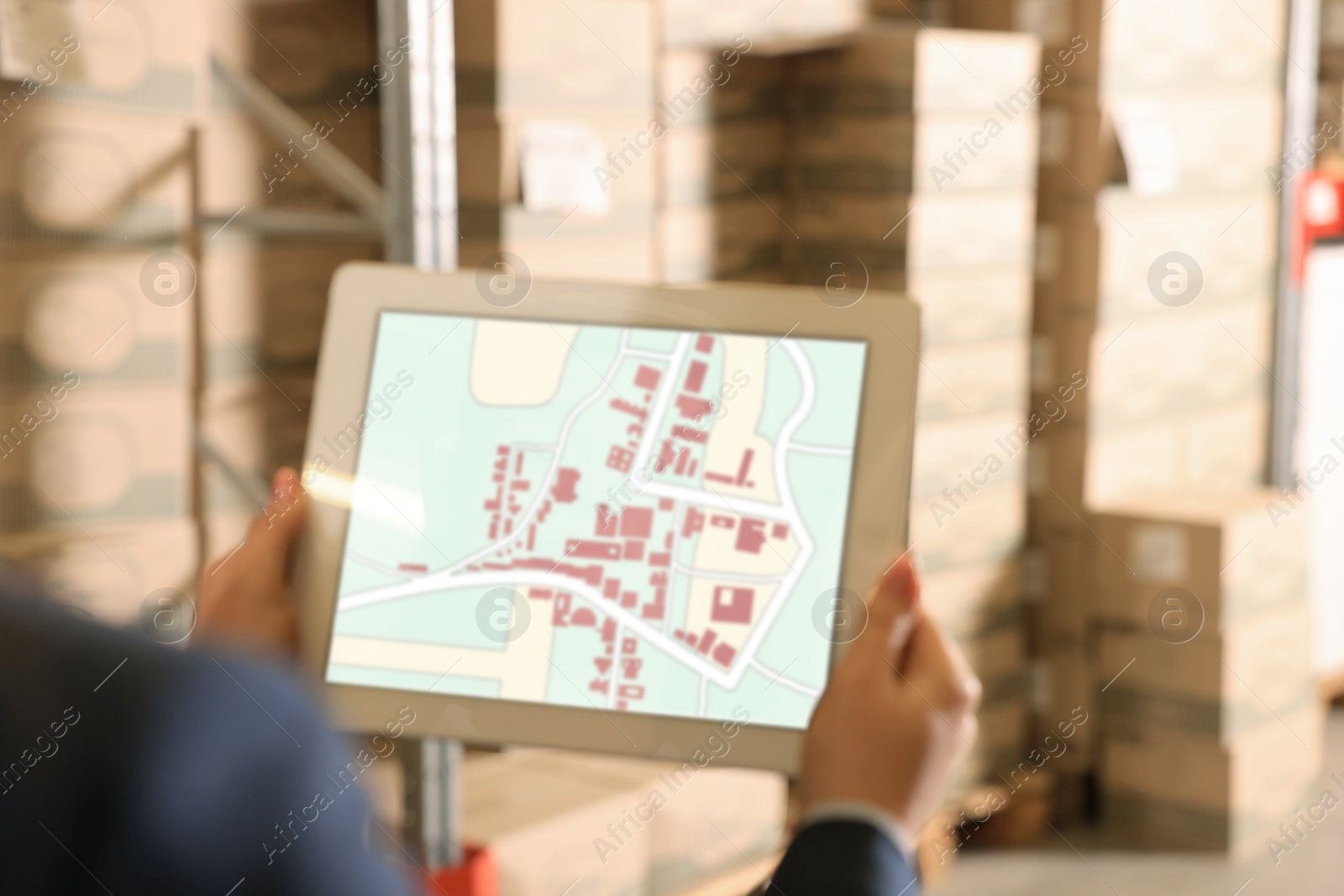 Image of Manager with tablet working at warehouse, closeup. Logistics center