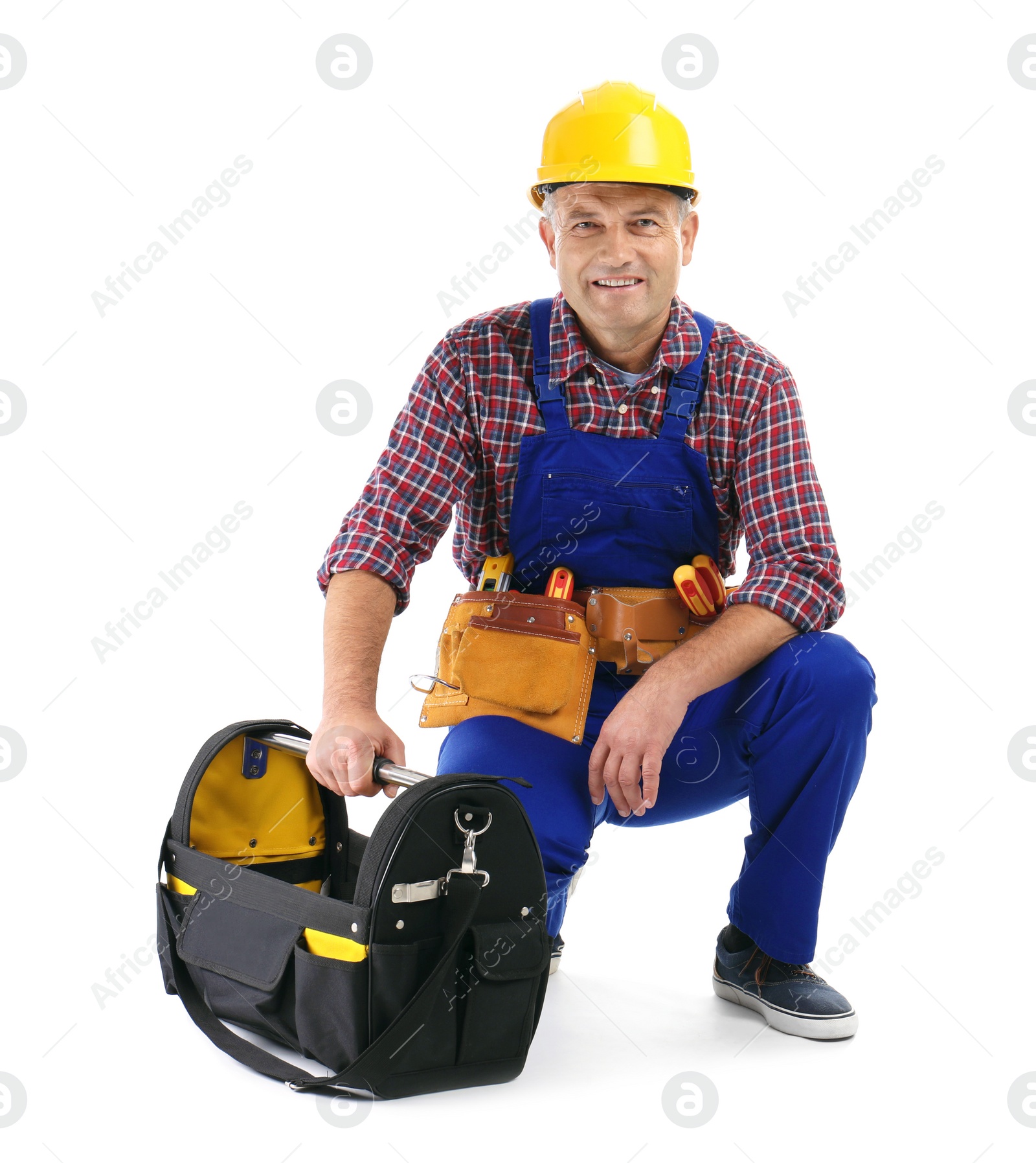 Photo of Electrician with tools wearing uniform on white background