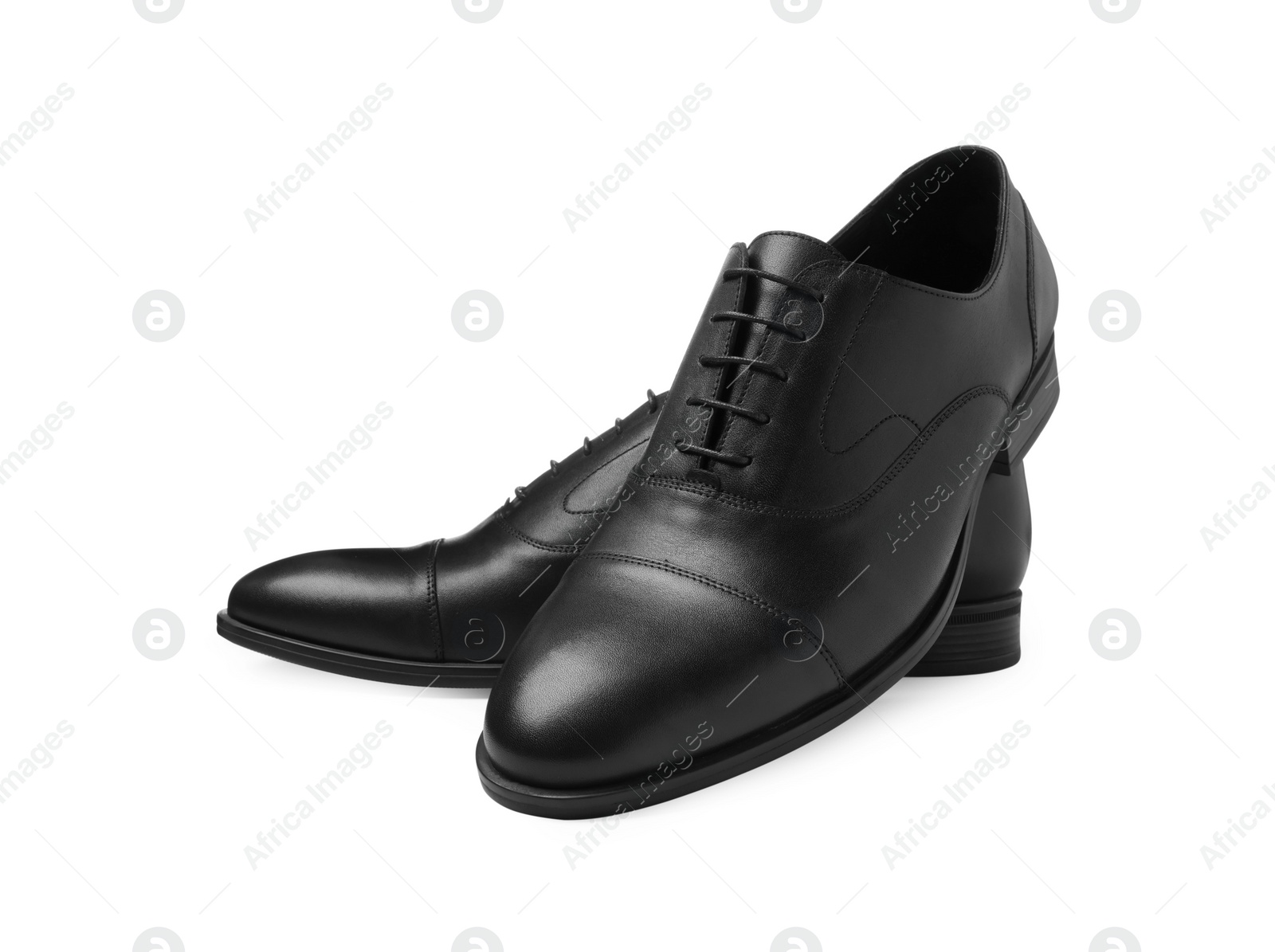 Photo of Pair of black leather men shoes isolated on white