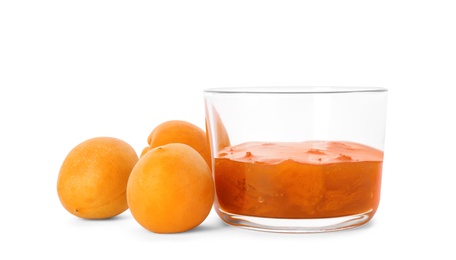 Photo of Bowl with tasty apricot jam and fruits on white background