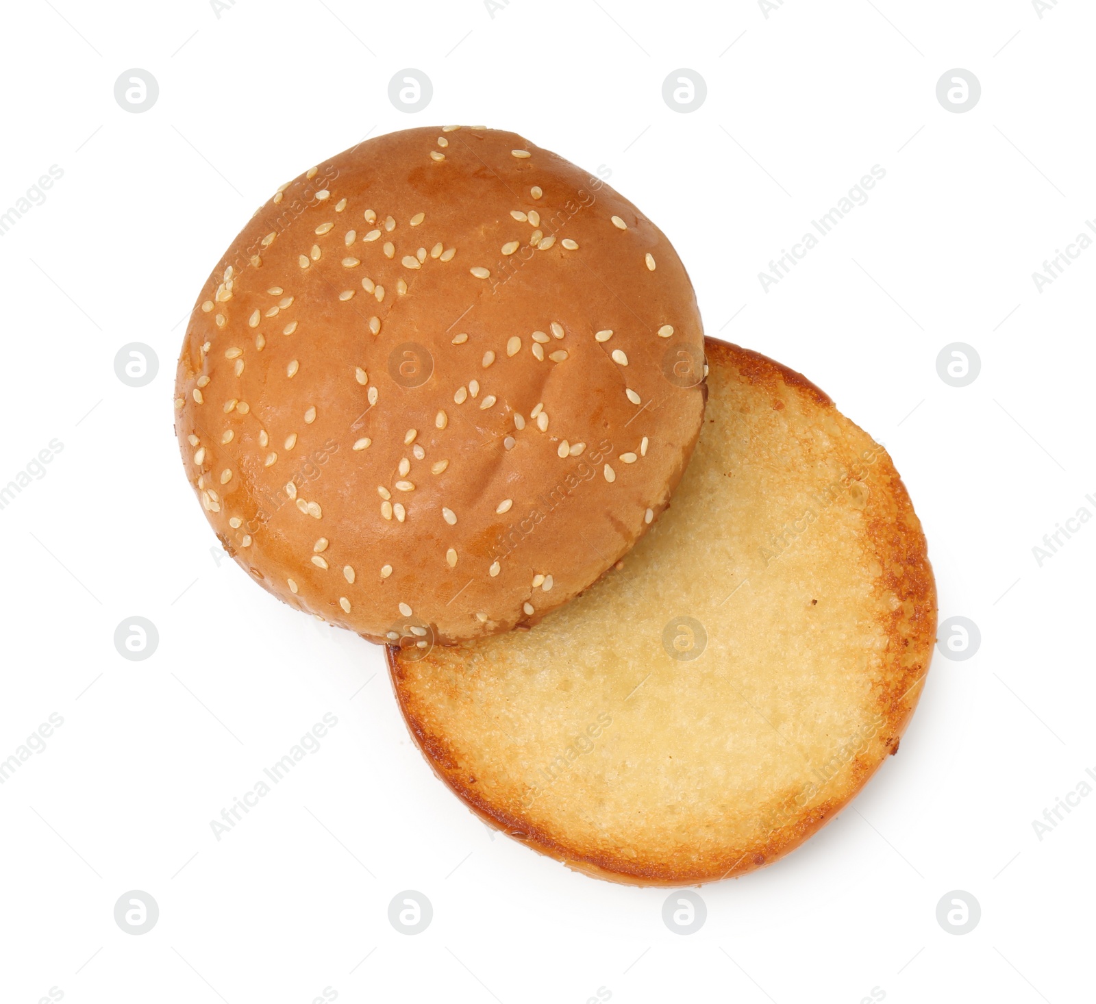 Photo of Halves of grilled burger bun isolated on white, top view