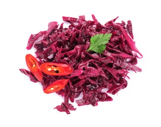 Photo of Pile of tasty red cabbage sauerkraut with chili pepper and parsley isolated on white, top view