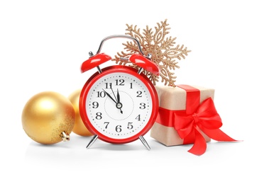 Photo of Alarm clock, gift and festive decor on white background. Christmas countdown