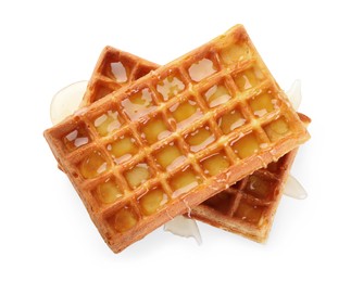 Photo of Delicious Belgian waffles with honey on white background, top view