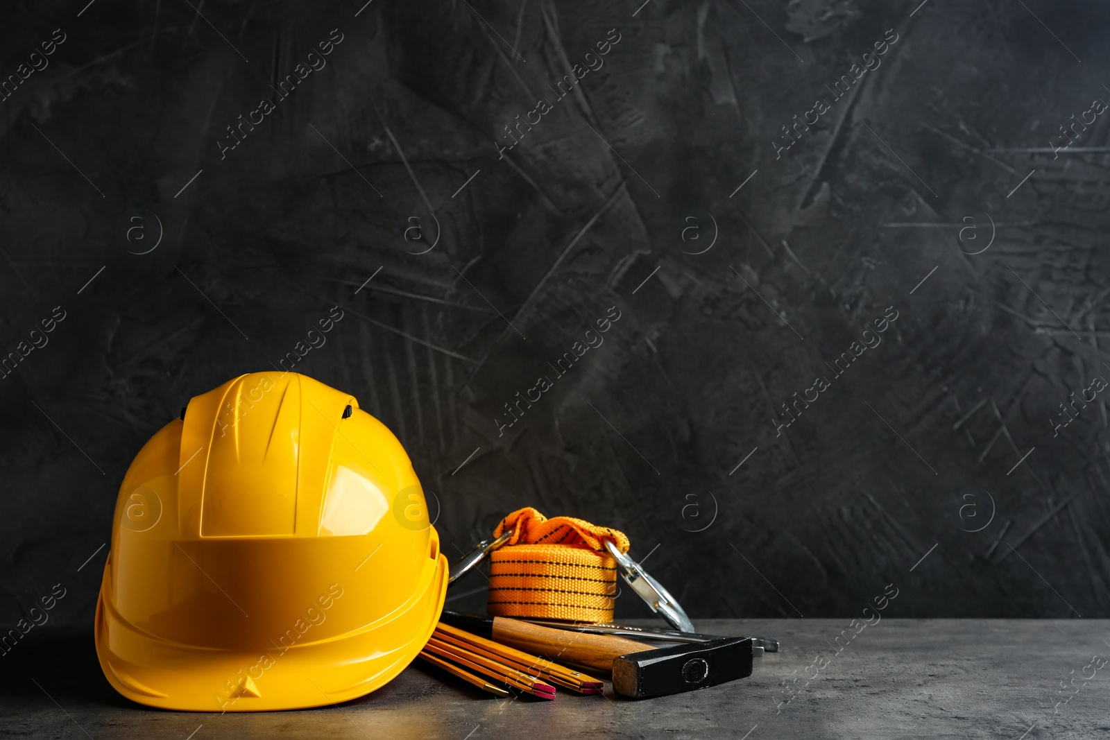 Photo of Composition with construction tools on grey table, space for text