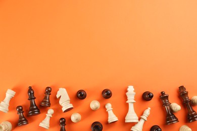 Photo of Chess pieces on orange background, flat lay with space for text. Board game components