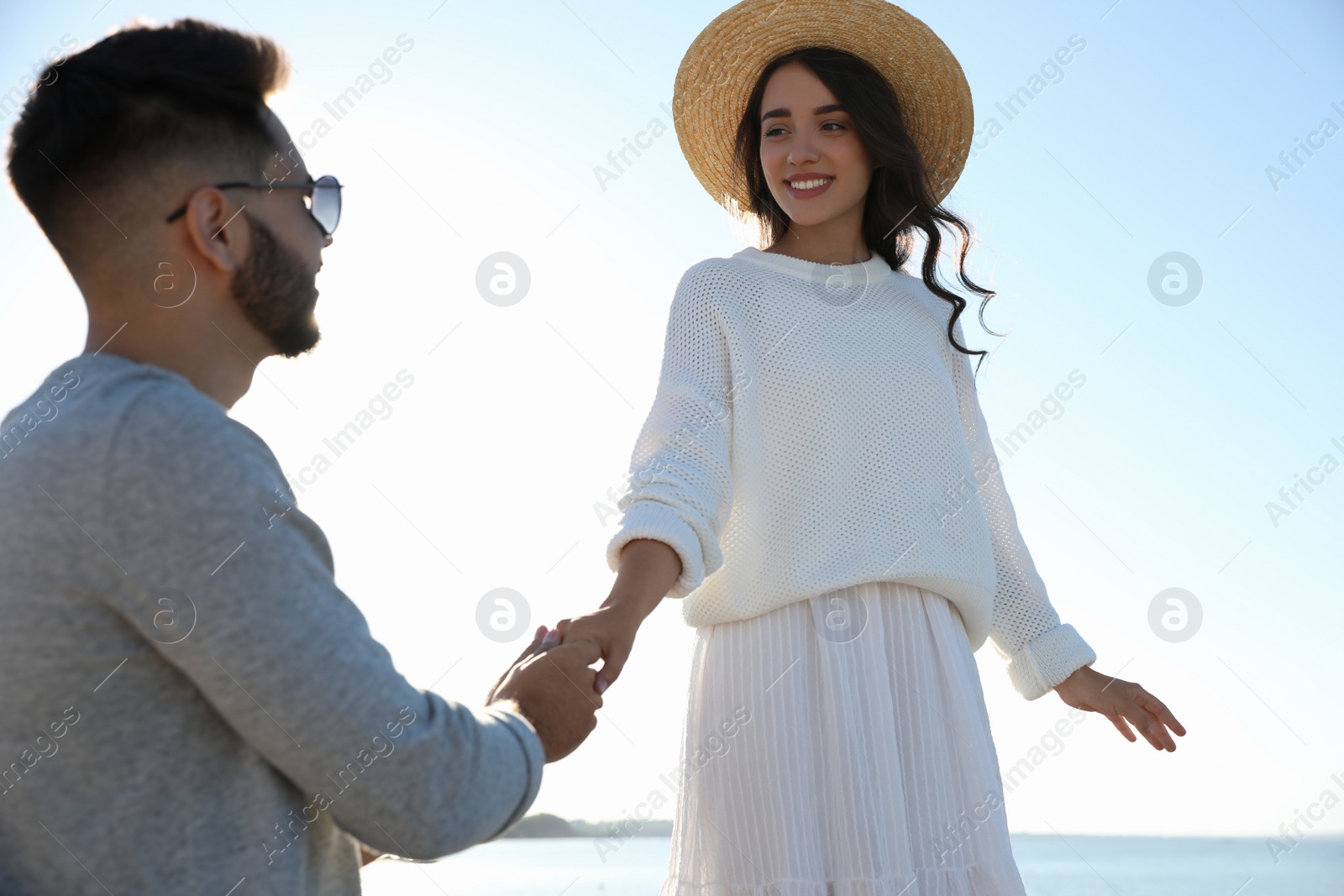 Photo of Happy young couple at beach. Honeymoon trip