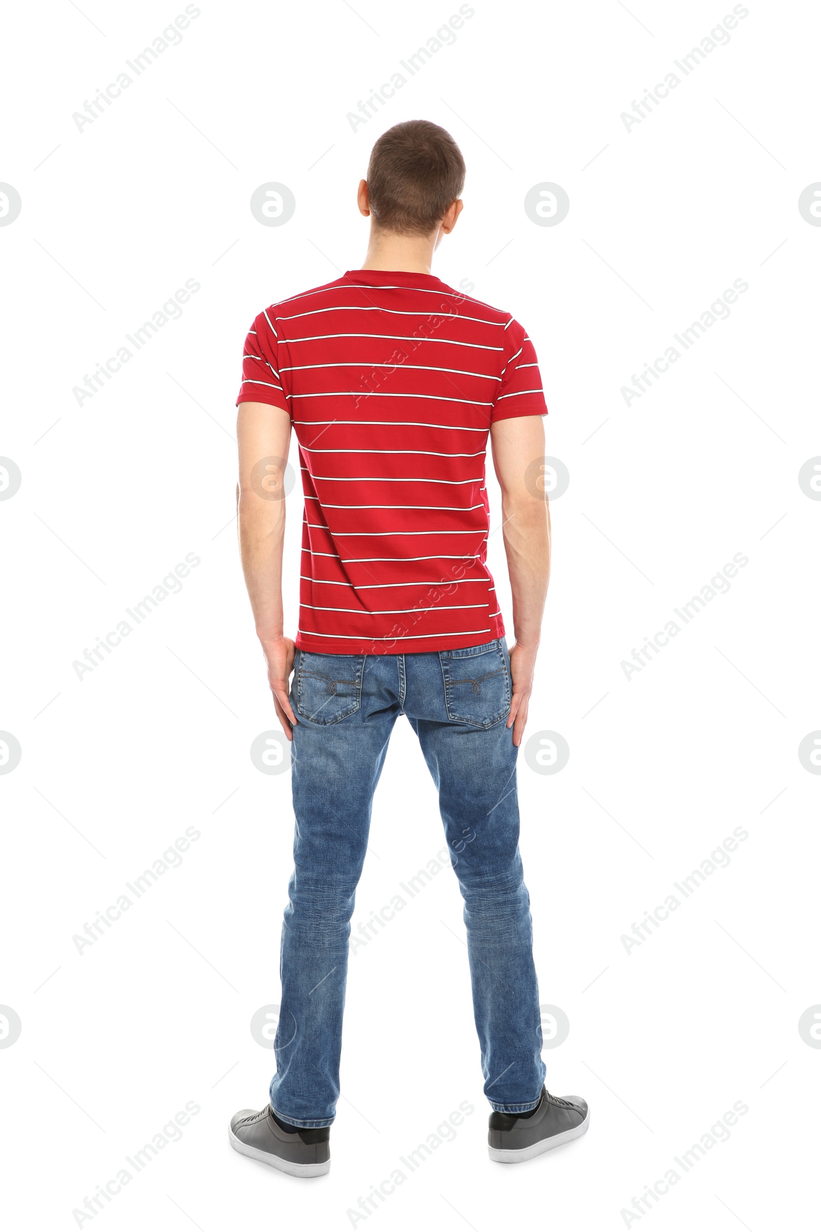 Photo of Young man in stylish clothes on white background, back view
