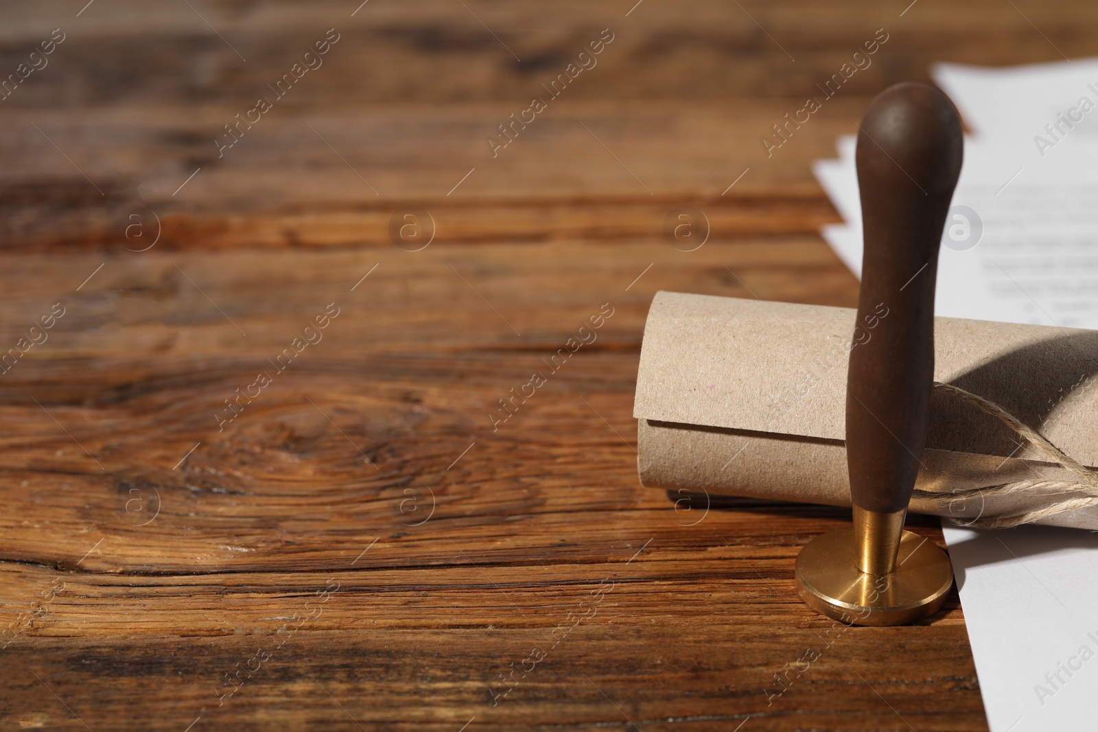 Photo of Notary contract. Wax stamp and scroll on wooden table, space for text