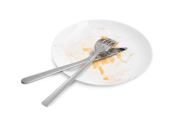Dirty plate and cutlery on white background