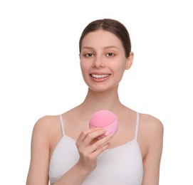 Washing face. Young woman with cleansing brush on white background