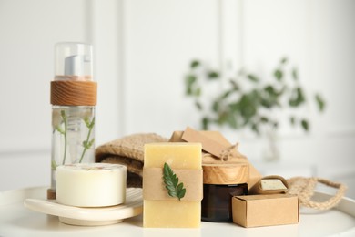 Photo of Eco friendly personal care products on white table indoors