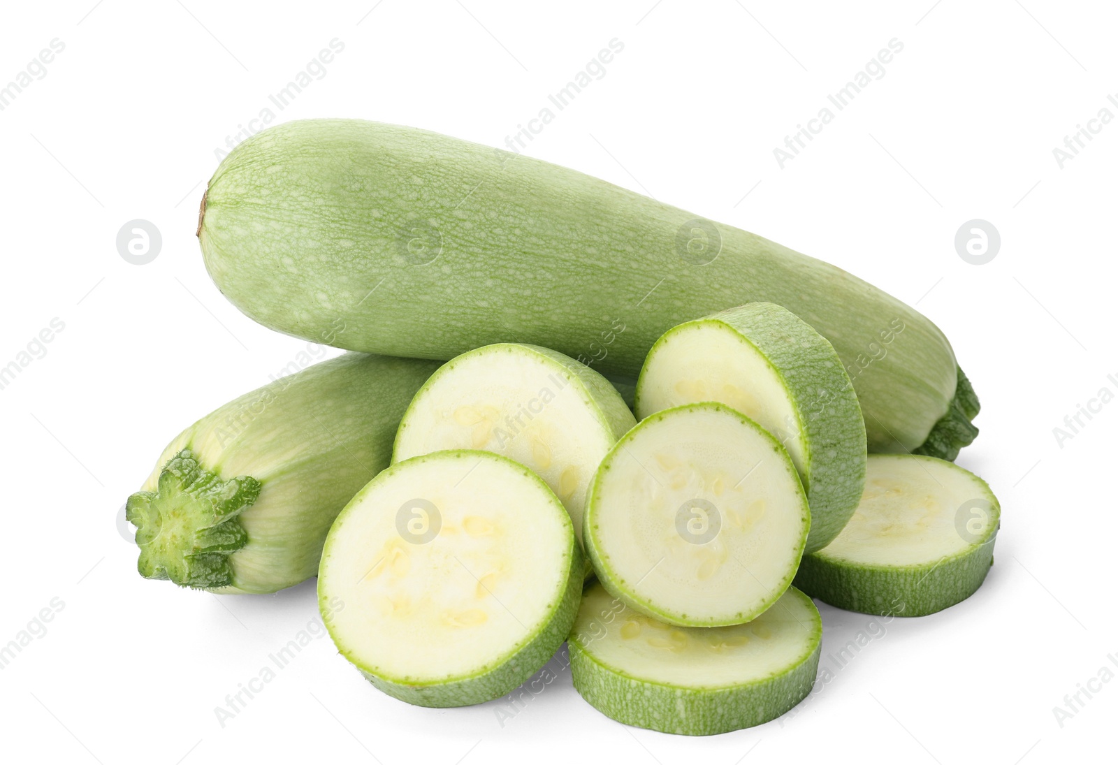 Photo of Cut and whole green ripe zucchinis on white background