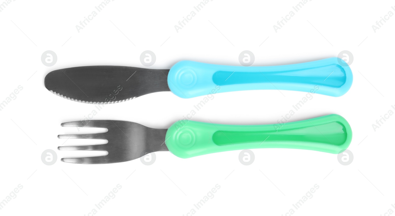 Photo of Small fork and knife isolated on white, top view. Serving baby food