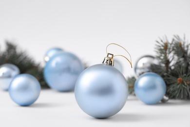 Photo of Beautiful blue Christmas ball on blurred background