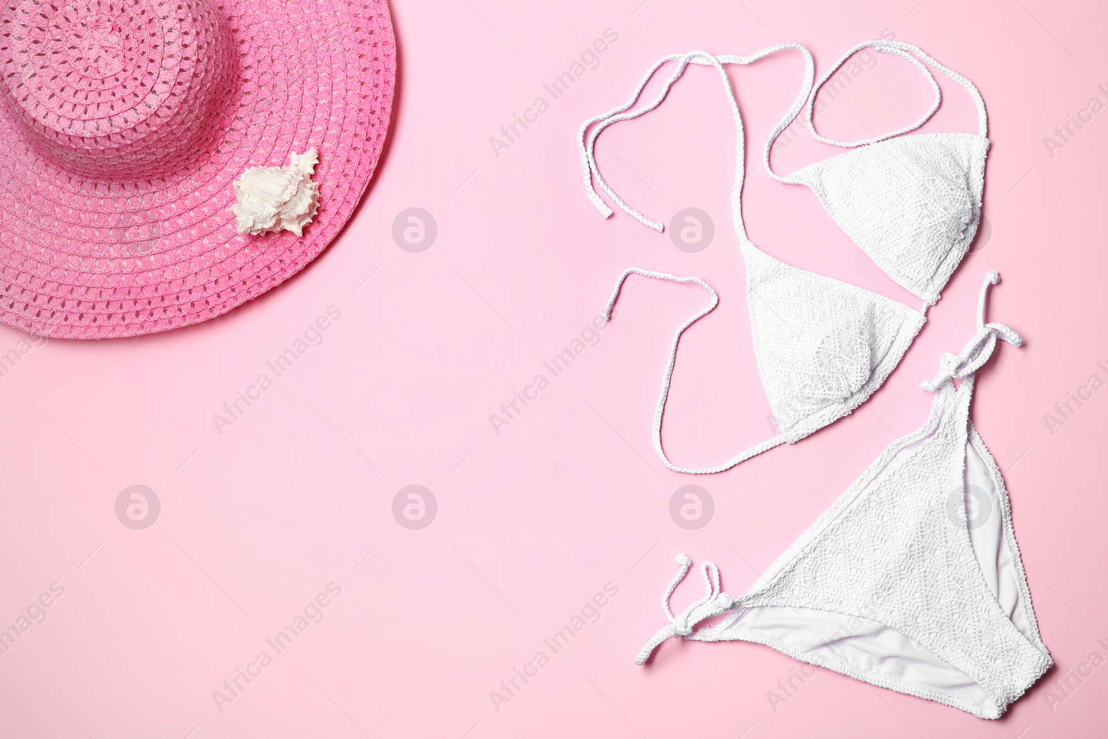 Photo of Flat lay composition with stylish bikini on color background. Space for text