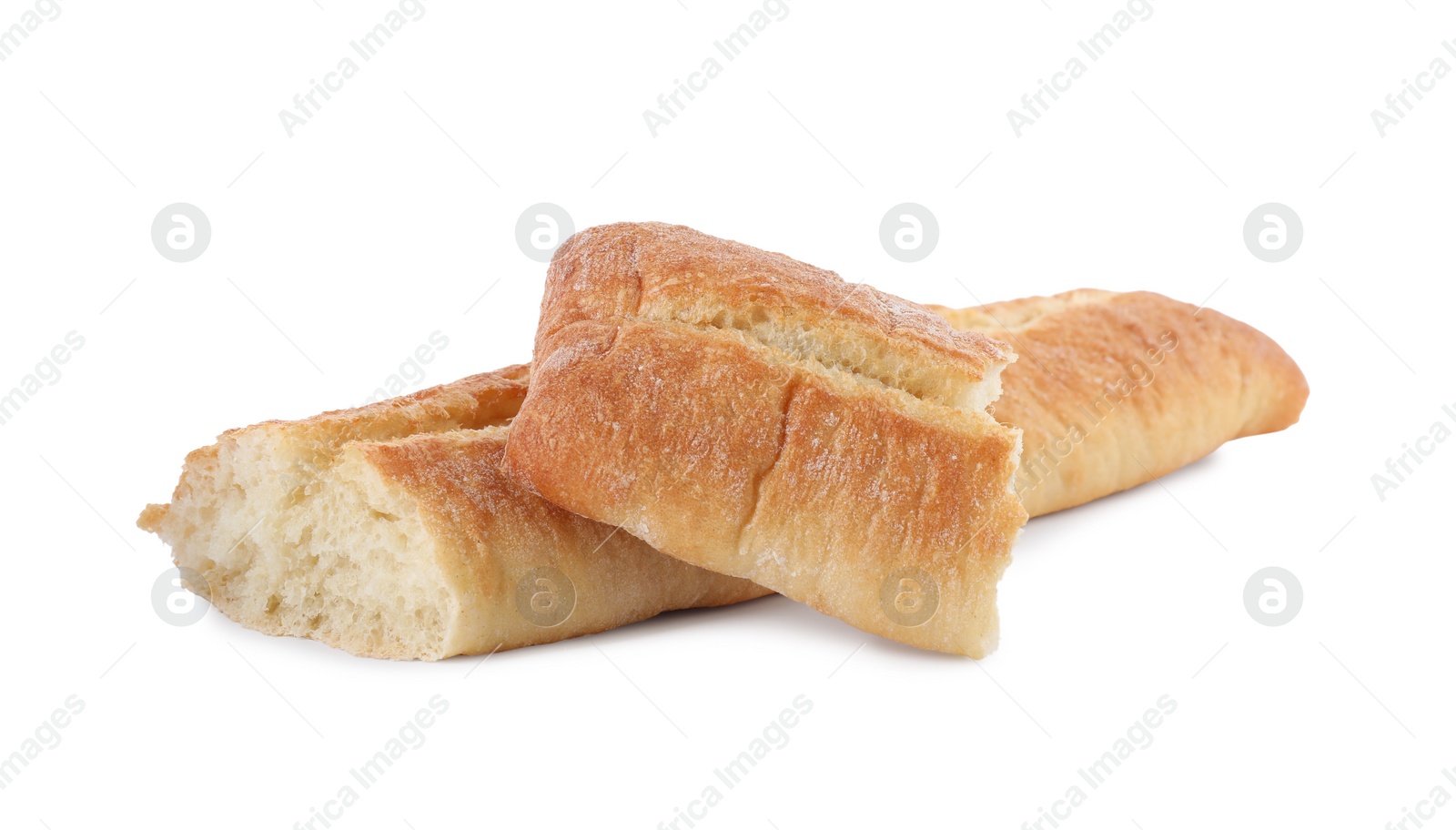 Photo of Pieces of fresh baguette on white background