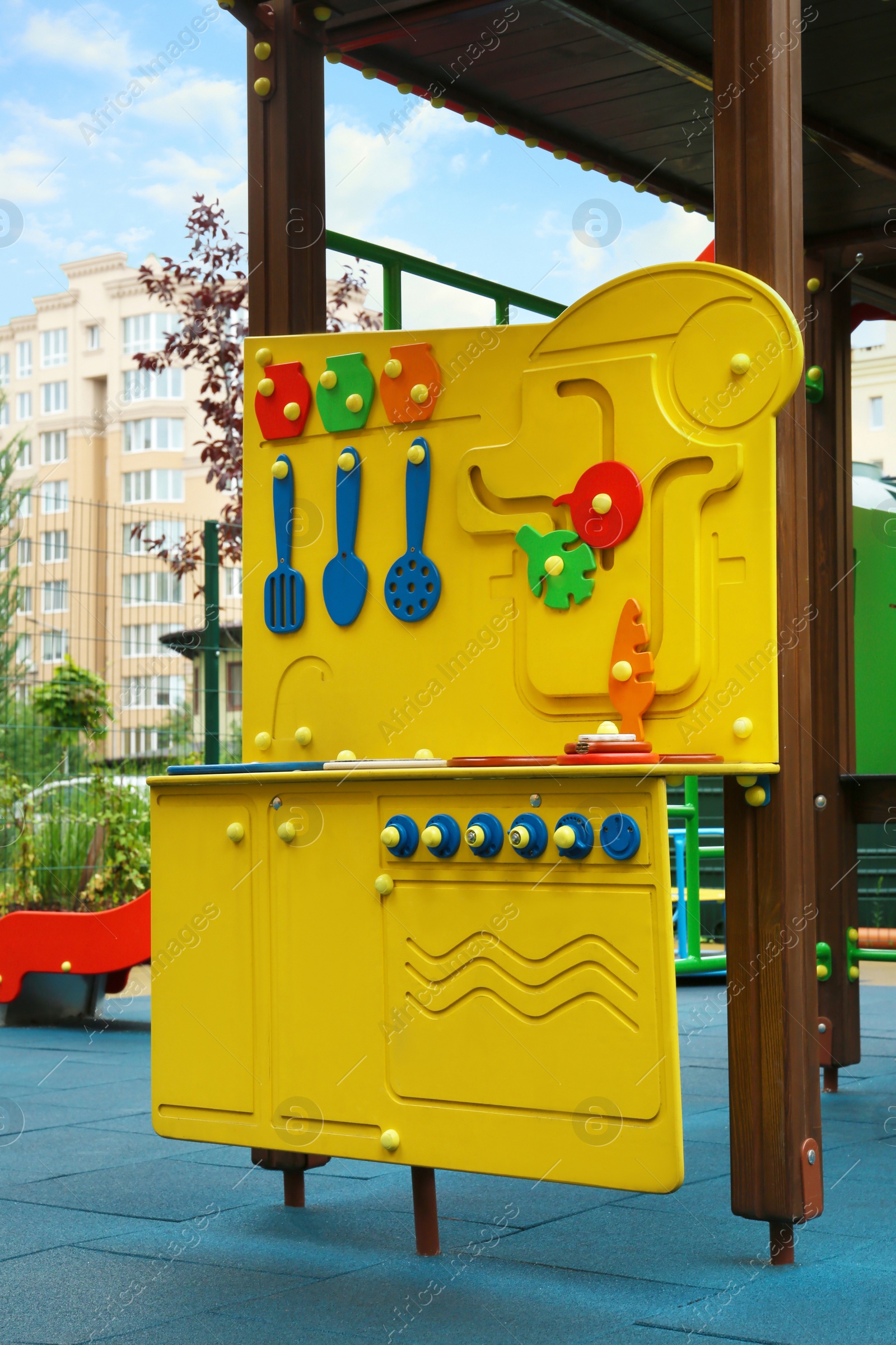 Photo of Colourful busy board on outdoor playground in residential area