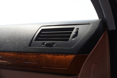 Photo of Air vent and airbag module in automobile, closeup