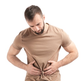 Photo of Young man suffering from abdominal pain on white background