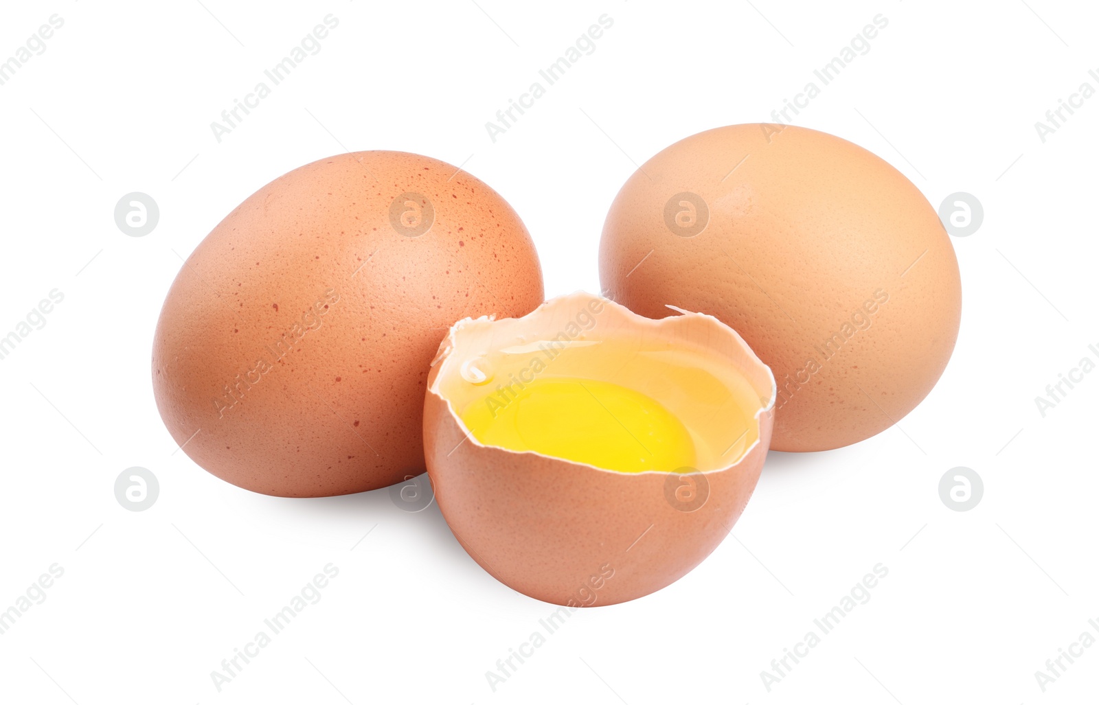 Photo of Whole and cracked chicken eggs isolated on white