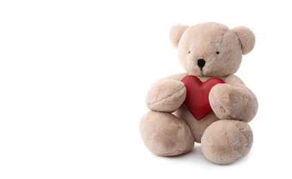 Photo of Cute teddy bear with red heart isolated on white. Valentine's day celebration
