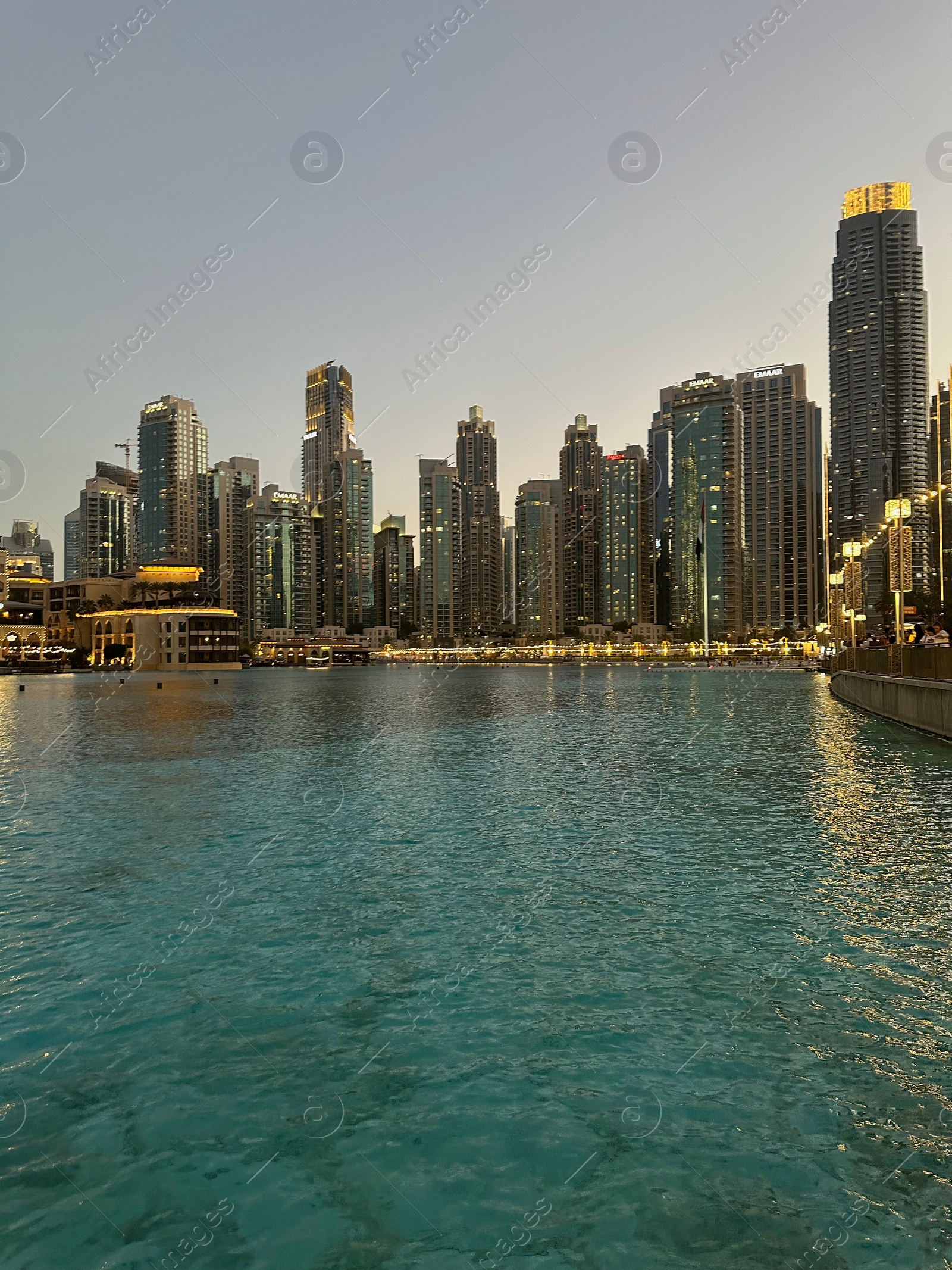 Photo of Dubai, United Arab Emirates - May 2, 2023: Beautiful modern buildings near embankment in city