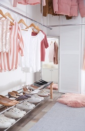 Photo of Modern dressing room with different stylish clothes and accessories