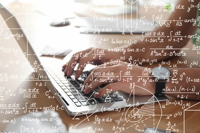 Image of Science and education concept. Illustration of basic physics and mathematics formulas and man working on laptop at table, closeup