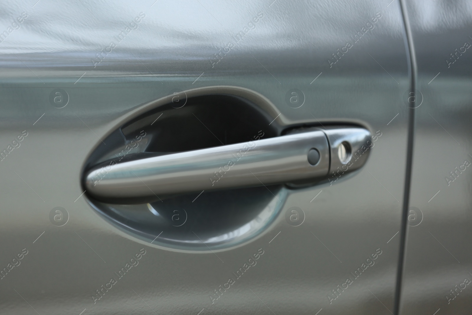 Photo of Closeup view of car door with handle