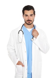 Young male doctor in uniform with stethoscope on white background. Medical service