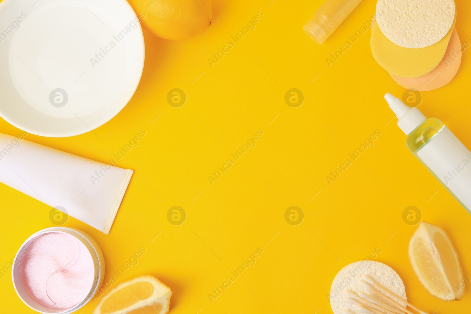 Photo of Lemon face cleanser. Frame of fresh citrus fruits and personal care products on yellow background, flat lay with space for text