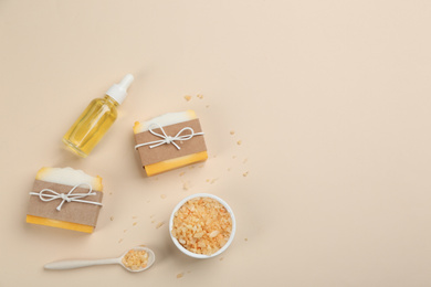 Photo of Flat lay composition with natural handmade soap on beige background. Space for text