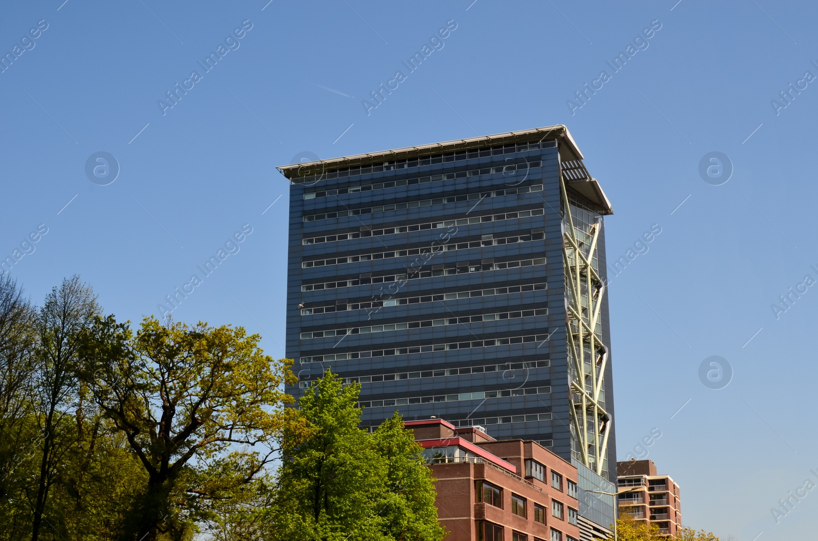 Photo of Exterior of beautiful modern building against blue sky
