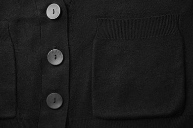 Photo of Black cardigan with pocket as background, top view