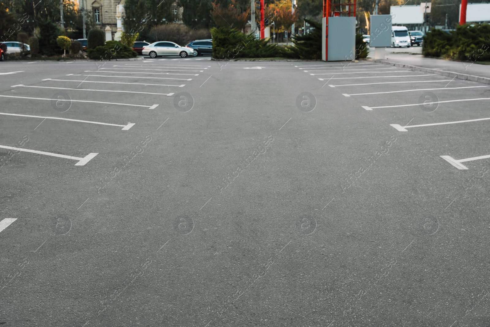 Photo of Car parking lots with white marking lines outdoors