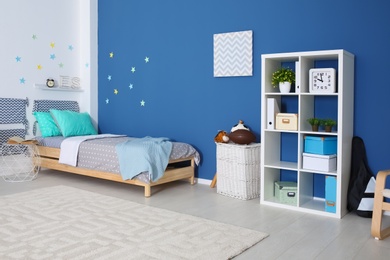 Modern child room interior with comfortable bed