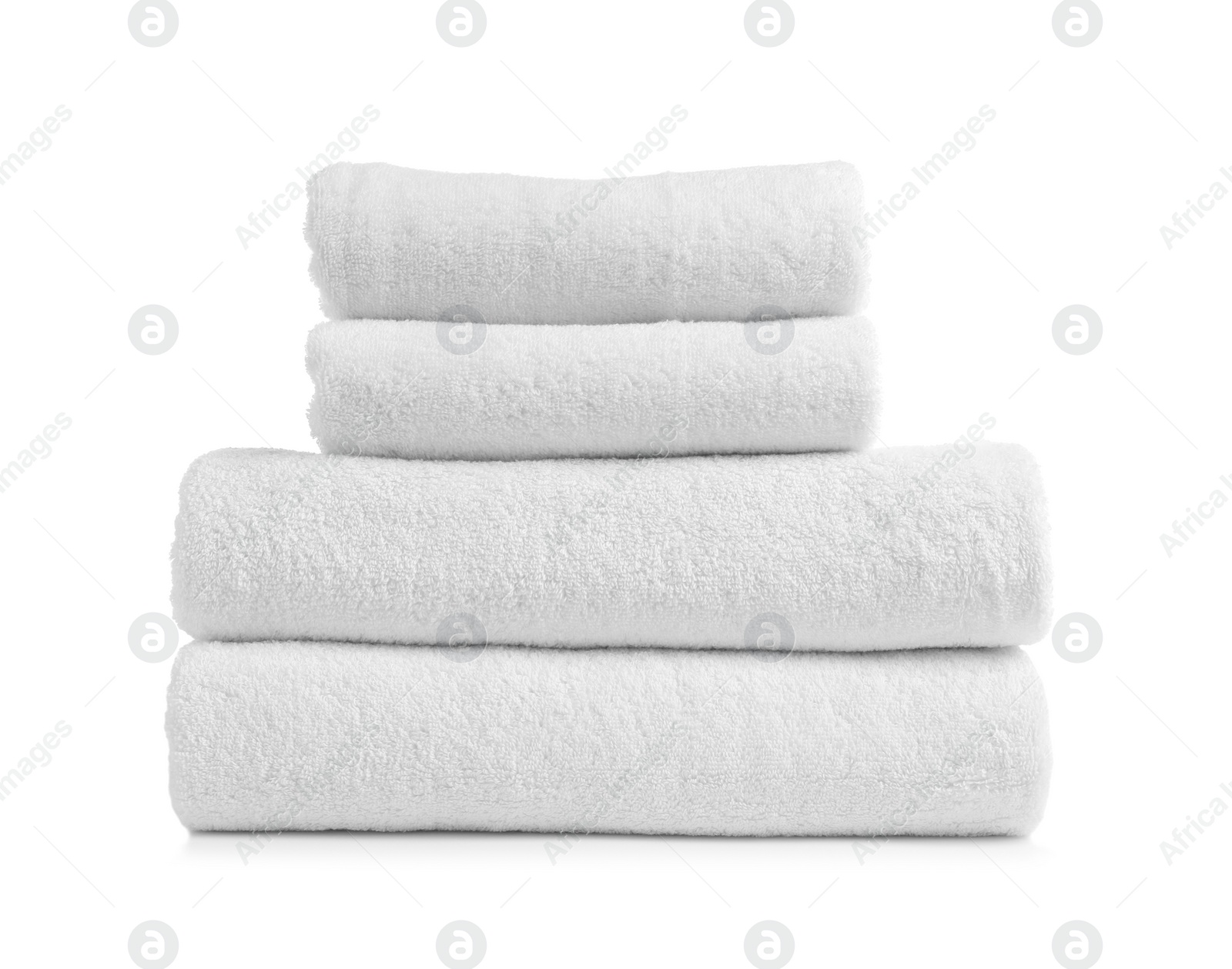 Photo of Stack of clean soft towels on white background