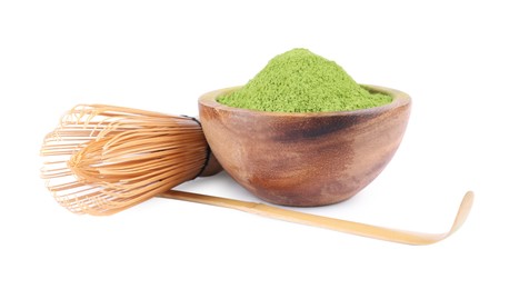 Bowl of green matcha powder, bamboo spoon and whisk isolated on white