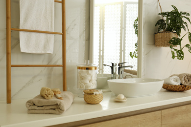 Photo of Large mirror and vessel sink in stylish bathroom
